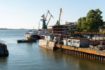 open dry dock on the background of the shipyard and cranes