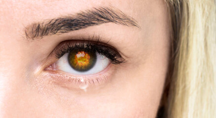 Obraz premium Woman's eye with a tear. War concept.