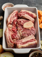 Set of raw meat for making broth. Raw fresh from butcher small pieces of veal bone with meat base for soup concentrate