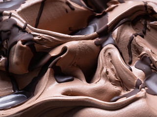 Chocolate flavour gelato - full frame detail. Close up of a brown surface texture of chocolate Ice cream covered with dark chocolate topping. - obrazy, fototapety, plakaty