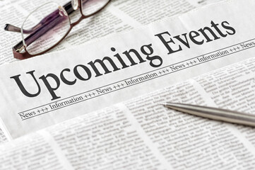 A newspaper with the headline Upcoming events