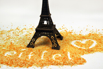 eiffel i am in love miniature with breadcrumbs on a white background