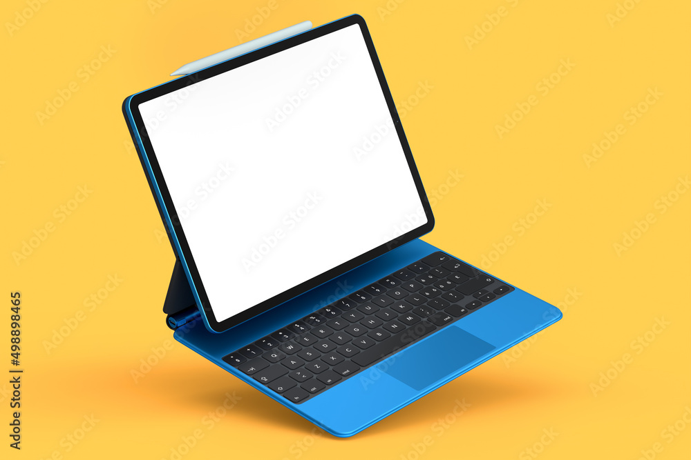 Poster computer tablet with keyboard and blank screen isolated on orange background.