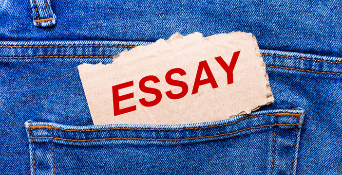 In the back pocket of the jeans there is a brown piece of paper with the text ESSAY