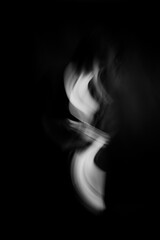 Abstract black and white blurred background, glare at long exposure, smudge