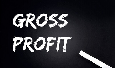 GROSS PROFIT Text on a Black Chalkboard with a piece of chalk