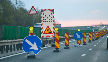 Road under construction. Traffic indicator signs that warns about a construction zone on A2 highway...