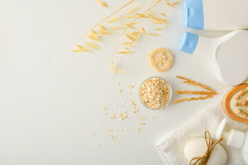 Shower products with oat and straws on white table top