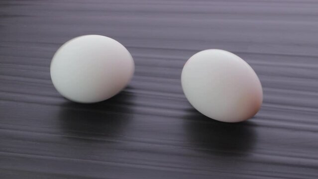 
Comparison of boiled and raw eggs. Boiled egg on the left.
