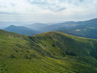 Obraz premium High mountains of the Ukrainian Carpathians in cloudy weather. Aerial drone view.