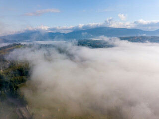 Morning fog in the Ukrainian Carpathians. Aerial drone view.