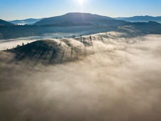 Morning fog in the Ukrainian Carpathians. Aerial drone view.
