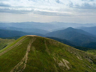 High mountains of the Ukrainian Carpathians in cloudy weather. Aerial drone view.