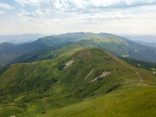 Naklejka premium High mountains of the Ukrainian Carpathians in cloudy weather. Aerial drone view.