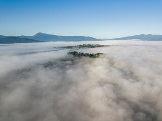 Morning fog in the Ukrainian Carpathians. Aerial drone view.