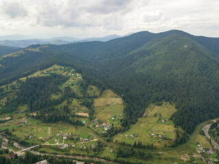 Obraz premium Green mountains of Ukrainian Carpathians in summer. Aerial drone view.