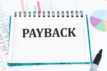 PAYBACK - word in a notebook. Business and finance concept