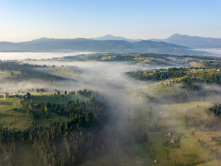 Morning fog in the Ukrainian Carpathians. Aerial drone view.