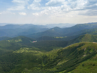 High mountains of the Ukrainian Carpathians in cloudy weather. Aerial drone view.