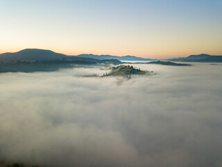 Morning fog in the Ukrainian Carpathians. Aerial drone view.