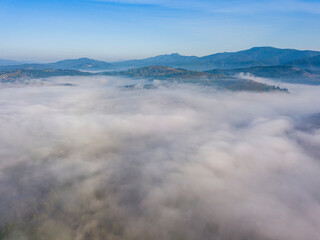 Morning fog in the Ukrainian Carpathians. Aerial drone view.