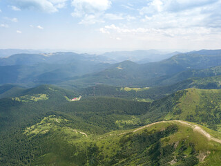 Fototapeta premium High mountains of the Ukrainian Carpathians in cloudy weather. Aerial drone view.