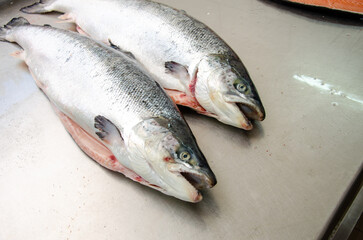 Red salmon fish. Salmon carcass on the table. Healthy eating red salmon fish. Photo on fish production.