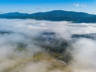 Foggy summer morning in the Ukrainian Carpathians. Aerial drone view.