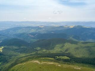 High mountains of the Ukrainian Carpathians in cloudy weather. Aerial drone view.