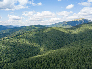 High mountains of the Ukrainian Carpathians in sunny weather. Aerial drone view.