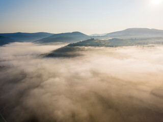 Morning fog in the Ukrainian Carpathians. Aerial drone view.