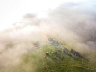 Morning mist in Ukrainian Carpathian mountains. Aerial drone view.