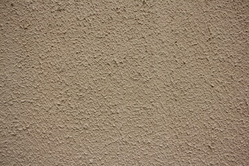 Pattern of light beige decorative and textured plaster. Construction and finishing materials for...
