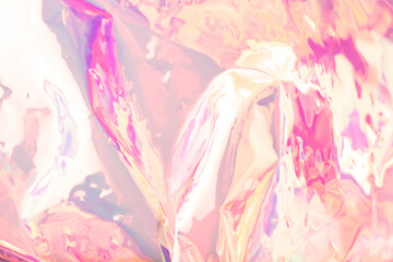 Fototapeta na wymiar Blurred colorful holographic background. Defocused textured gradient in pink colors.