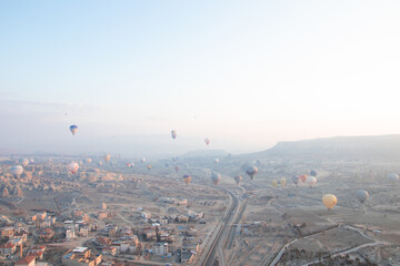 Naklejka premium Landscape of Cappadocia with hot air balloons, aerial view