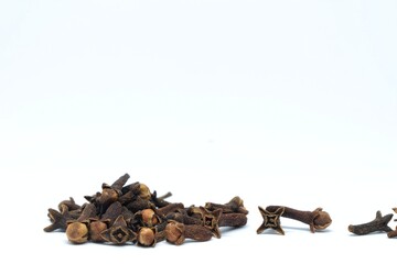 A picture of cloves, spice (masala) used extensively in India in food with white background. 