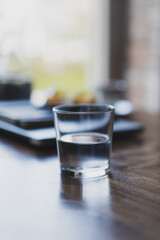 glass of water on a table in a cafe