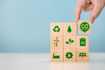 Net zero and carbon neutral concept. Put wooden cubes with green net zero icon. CO2 Net-Zero...