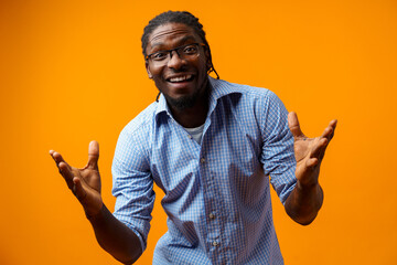 Photo of excited ecstatic overjoyed black man against yellow background