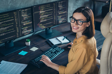 Profile side view portrait of attractive cheerful skilled girl geek developing web site cyber...