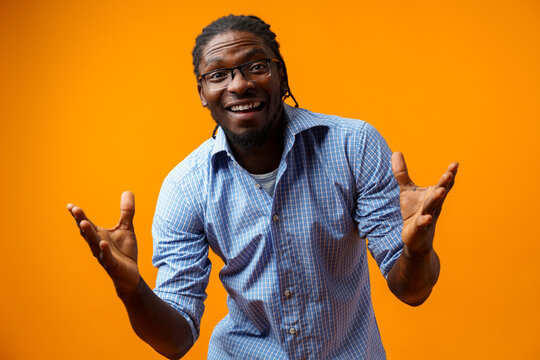 Photo Of Excited Ecstatic Overjoyed Black Man Against Yellow Background