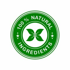 badge or stamp 100 % natural ingredients on eco friendly rounded tag  from a green surface