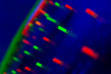 bright neon colored glowing diodes on a blue background