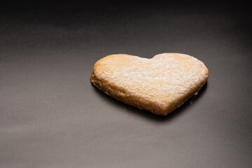 Shortbread in the shape of a heart isolated on white background.