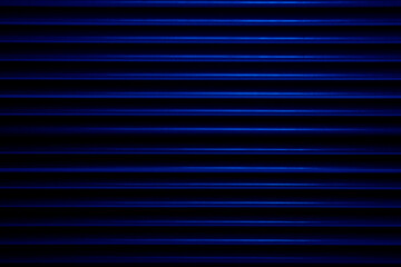 Stripes of blue light cut through the darkness creating an ideal background for textures and patterns.