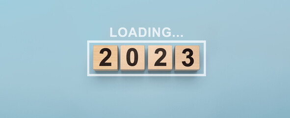 2023 New Year Loading. Loading new year 2023 with wood cube in progress bar. creative background...