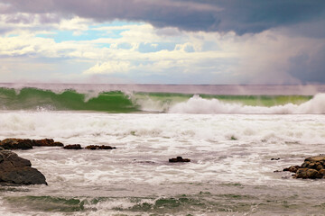 Pebbly Beach at Forster in NSW Australia with storm clouds in distance