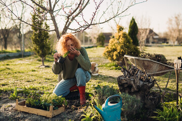 woman enjoying time gardening in her backyard