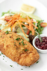 chicken cordon bleu meal with salad in french restaurant