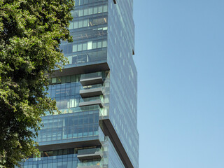 Modern high-rise glass and concrete office building in the city..Copy space